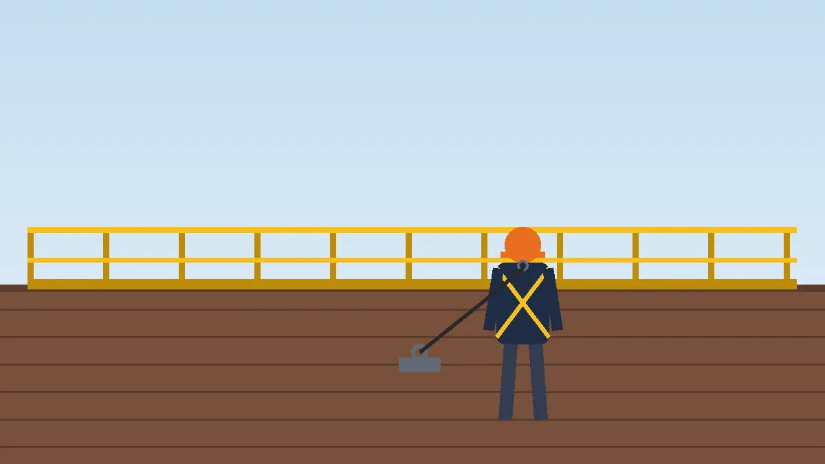 Roofer in a harness tied off to a roof anchor next to a guardrail